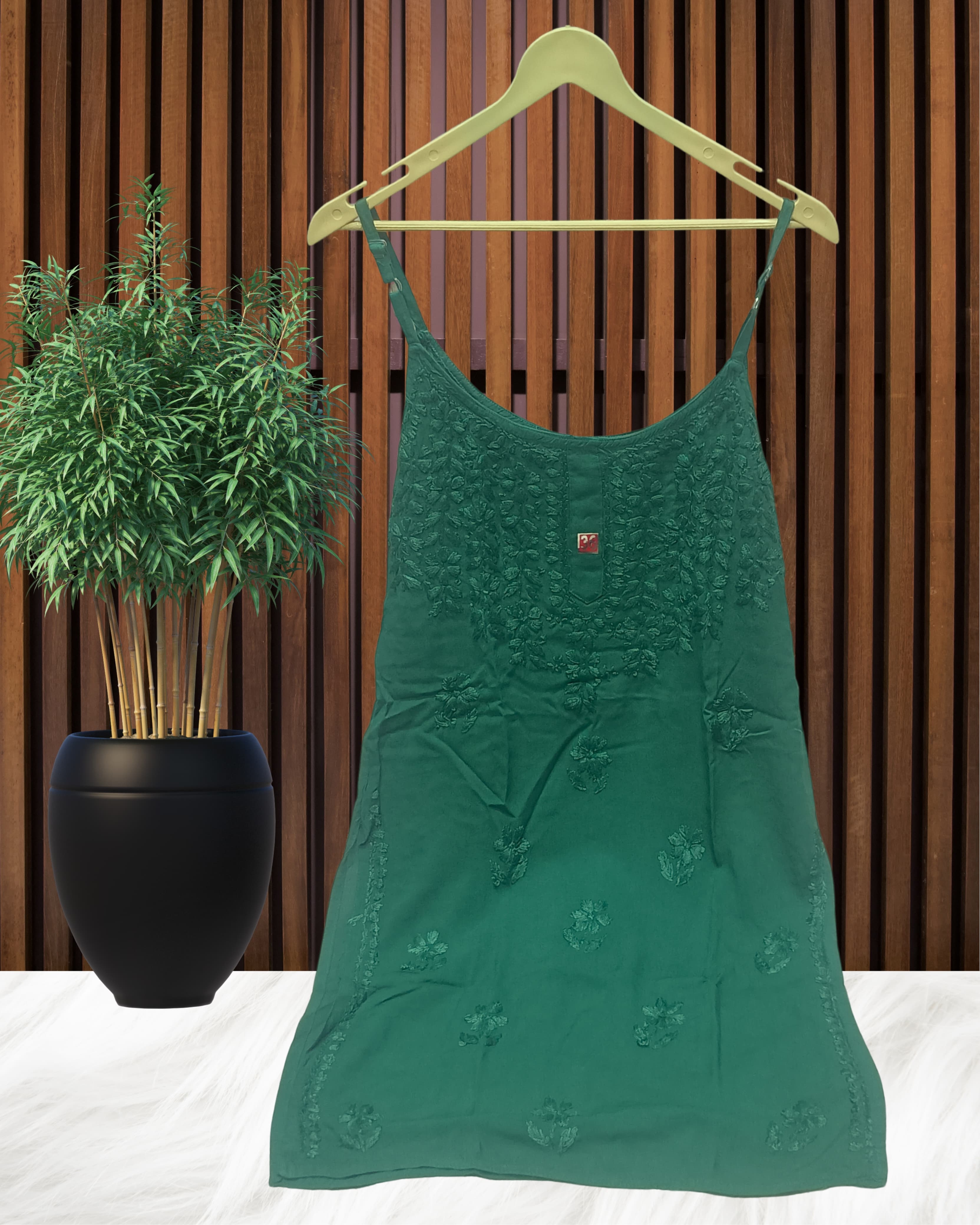 alt="Lucknowi chikankari tone to tone handwork sleeveless short top", alt="Noodle strap short chikankari top in premium rayon fabric", alt="Hand embroidered Lucknowi chikankari short top for women XXS to L", alt="Tone to tone chikankari work sleeveless kurti style top", alt="Premium rayon chikankari noodle strap short kurti top", alt="Lucknowi chikankari sleeveless short kurti with hand embroidery"