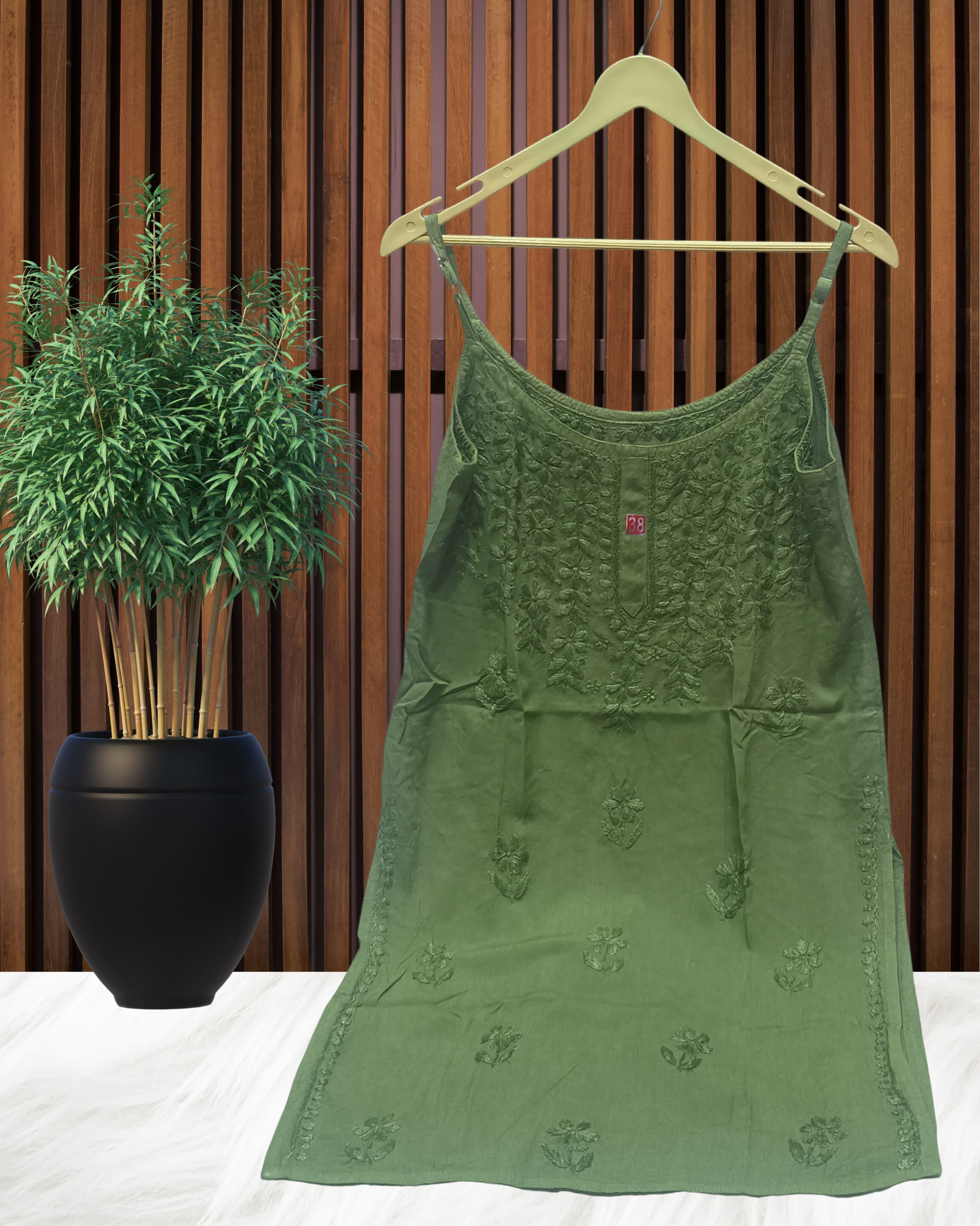 alt="Lucknowi chikankari tone to tone handwork sleeveless short top", alt="Noodle strap short chikankari top in premium rayon fabric", alt="Hand embroidered Lucknowi chikankari short top for women XXS to L", alt="Tone to tone chikankari work sleeveless kurti style top", alt="Premium rayon chikankari noodle strap short kurti top", alt="Lucknowi chikankari sleeveless short kurti with hand embroidery"