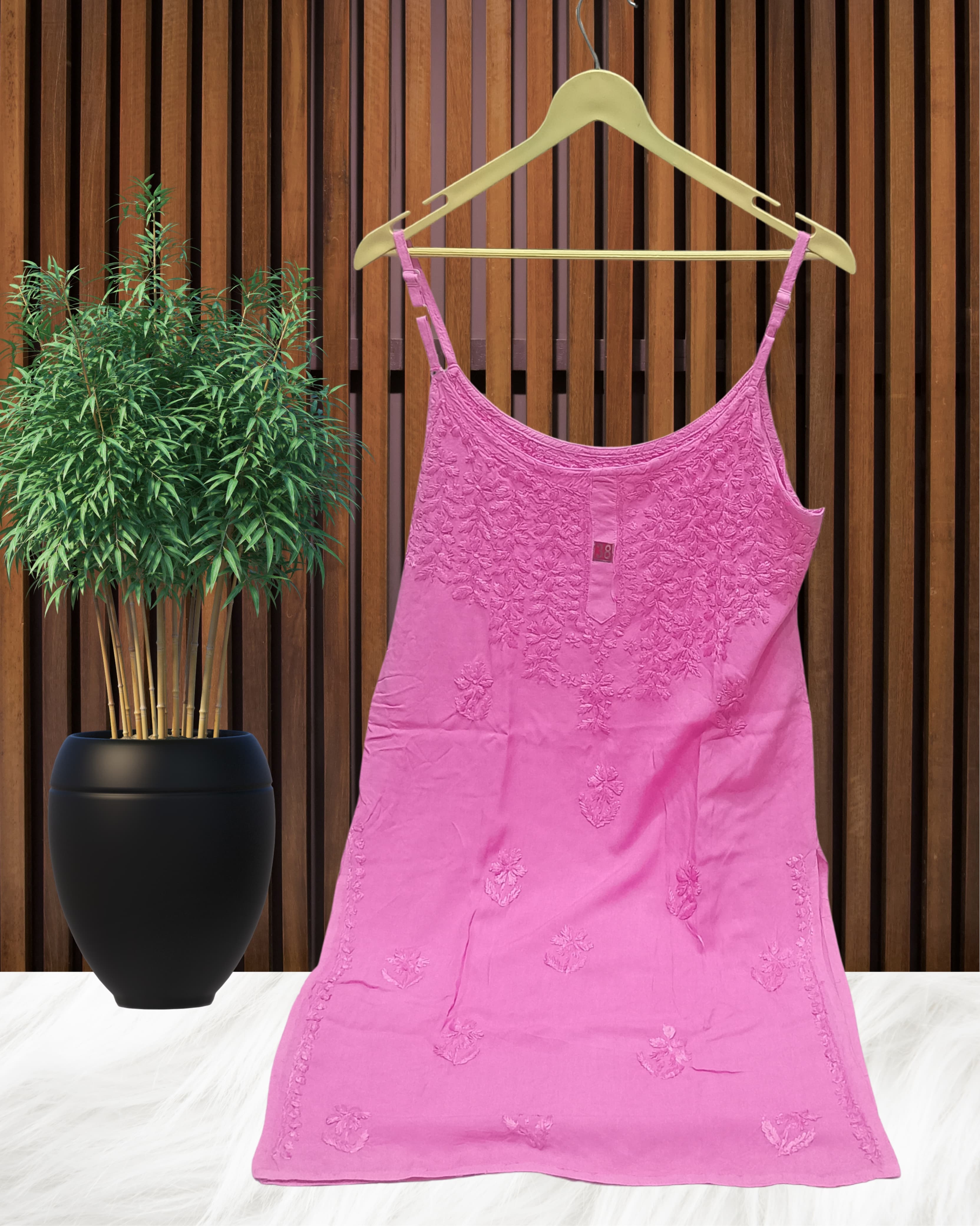 alt="Lucknowi chikankari tone to tone handwork sleeveless short top", alt="Noodle strap short chikankari top in premium rayon fabric", alt="Hand embroidered Lucknowi chikankari short top for women XXS to L", alt="Tone to tone chikankari work sleeveless kurti style top", alt="Premium rayon chikankari noodle strap short kurti top", alt="Lucknowi chikankari sleeveless short kurti with hand embroidery"