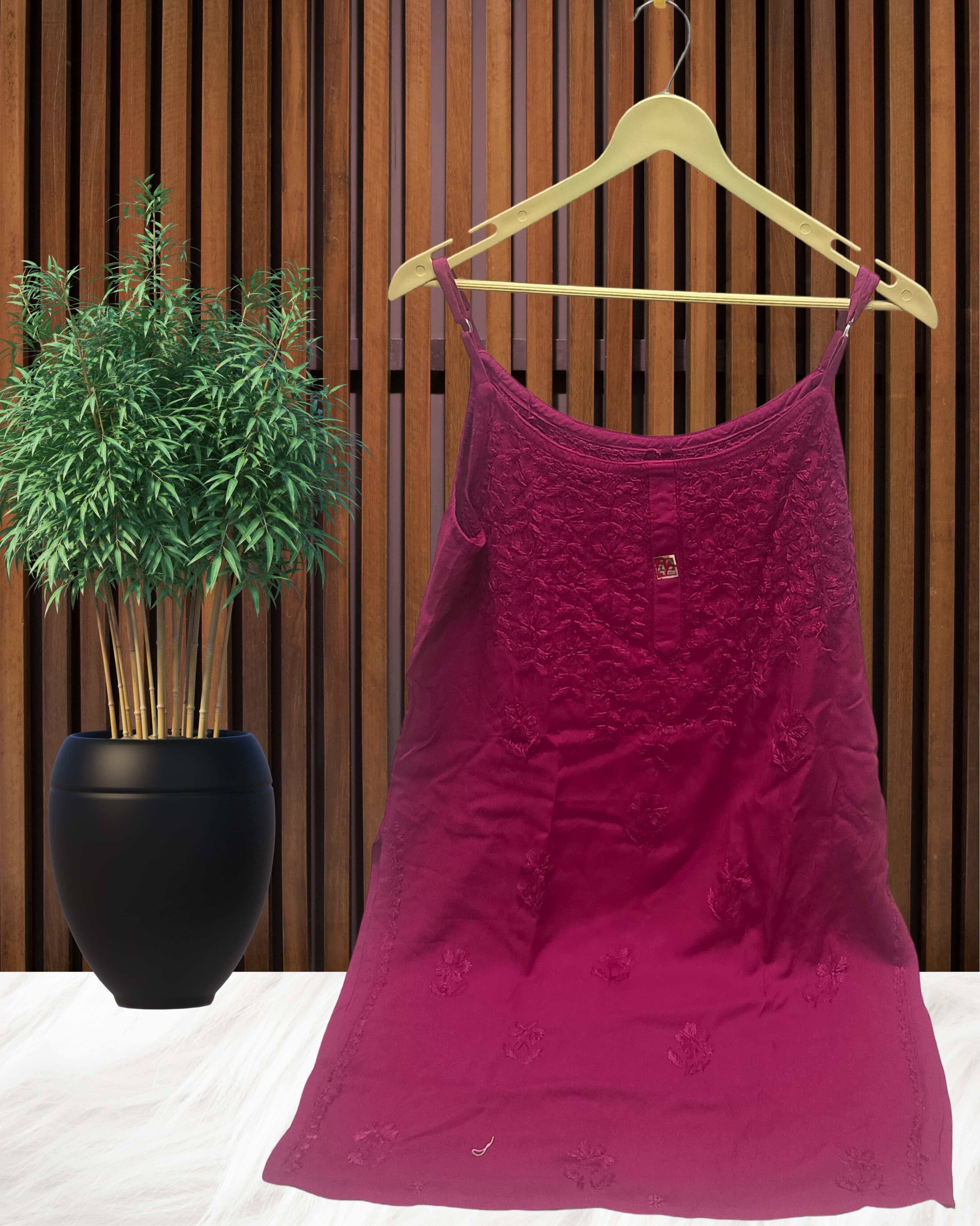 alt="Lucknowi chikankari tone to tone handwork sleeveless short top", alt="Noodle strap short chikankari top in premium rayon fabric", alt="Hand embroidered Lucknowi chikankari short top for women XXS to L", alt="Tone to tone chikankari work sleeveless kurti style top", alt="Premium rayon chikankari noodle strap short kurti top", alt="Lucknowi chikankari sleeveless short kurti with hand embroidery"