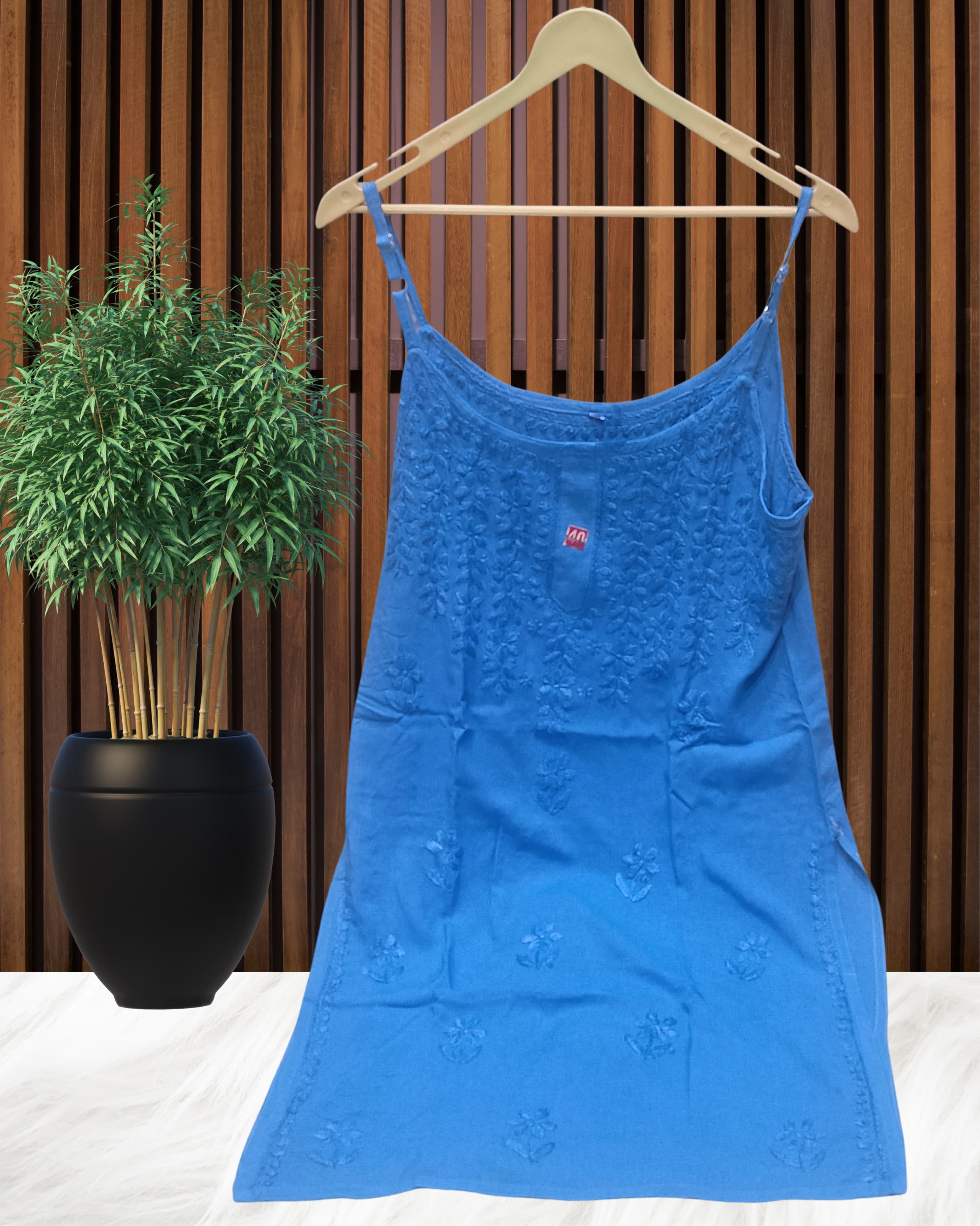 alt="Lucknowi chikankari tone to tone handwork sleeveless short top", alt="Noodle strap short chikankari top in premium rayon fabric", alt="Hand embroidered Lucknowi chikankari short top for women XXS to L", alt="Tone to tone chikankari work sleeveless kurti style top", alt="Premium rayon chikankari noodle strap short kurti top", alt="Lucknowi chikankari sleeveless short kurti with hand embroidery"