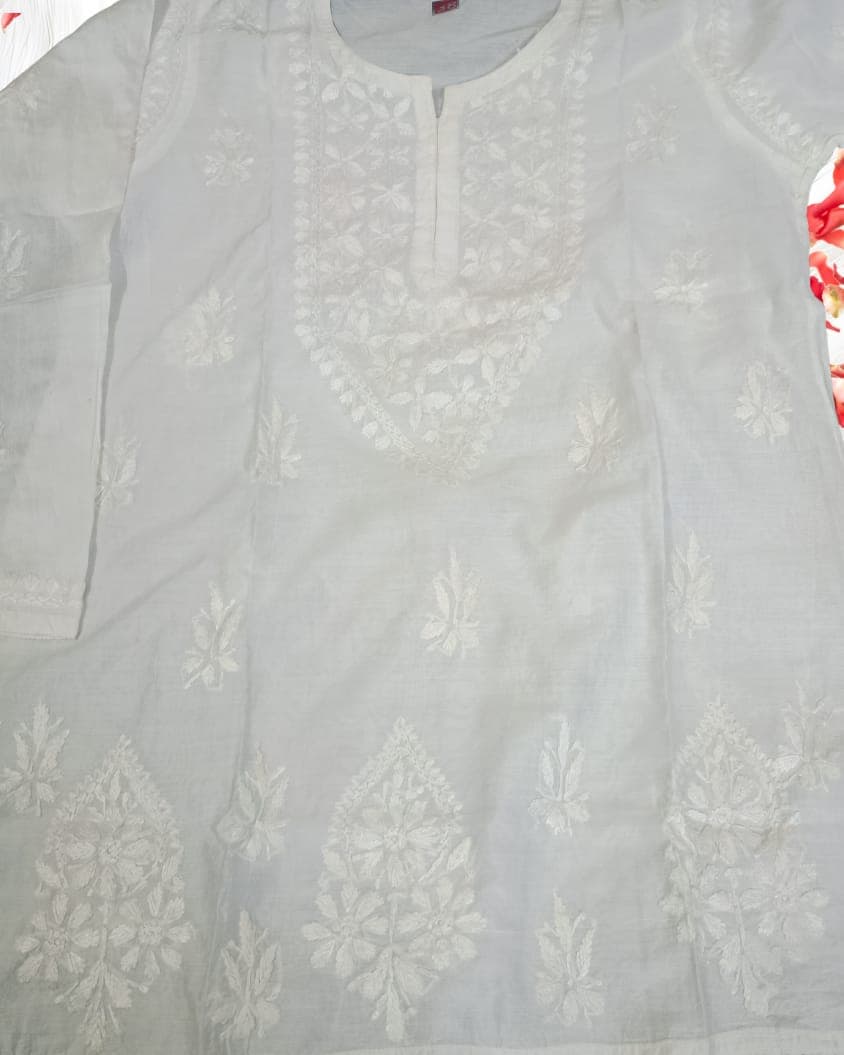 White Lucknowi Chikankari Short Top on Chanderi Fabric – Pairahan Chikan  Hand Embroidered Chanderi Chikankari Short Kurti in White – Size S–XXL  Front view of Pairahan Chikan White Lucknowi Chikankari Short Top  Close-up of hand embroidery on White Chanderi Chikankari Short Top  Back view of Lucknowi Chikankari Short Kurti in White – Chanderi Fabric  Pairahan Chikan White Chikankari Short Top styled with palazzo pants  Elegant White Chanderi Chikankari Short Kurti for women – Sizes S to XXL  Lucknowi handwork embroidery detail on Pairahan Chikan Short Top